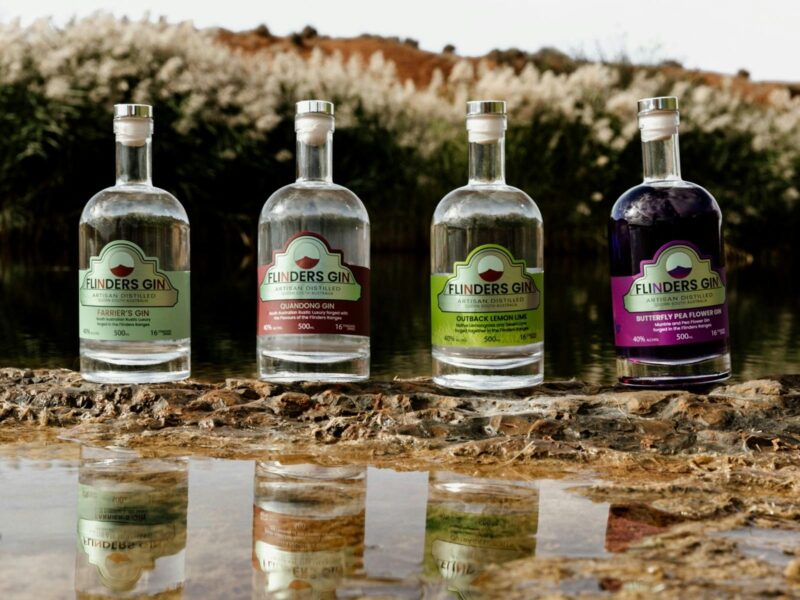 Four Flinders Gin varieties with reflection in water