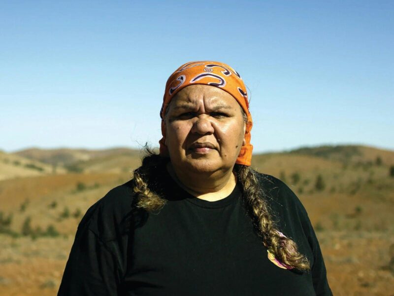 An image of Lavene Ngatokorua taken against a rural Australian backdrop