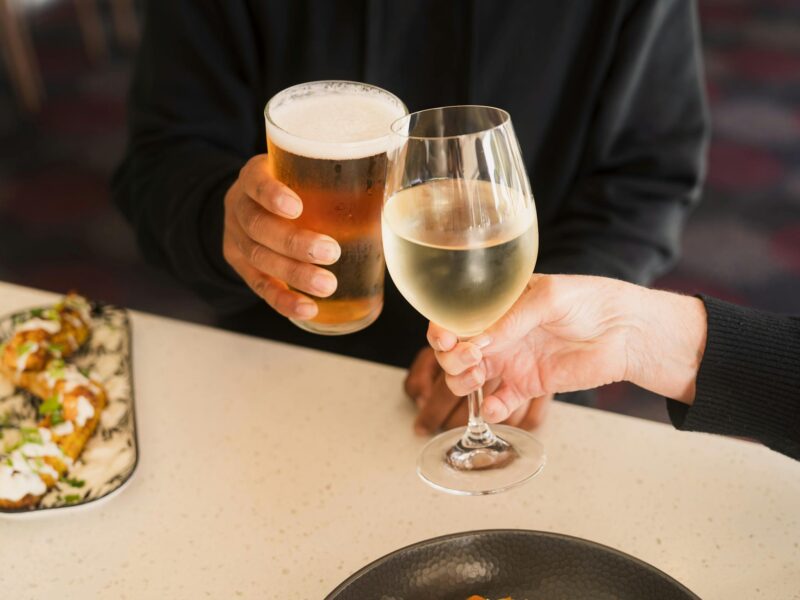 Toasting with beer and wine in a warm, welcoming setting at the Pastoral Hotel Motel.