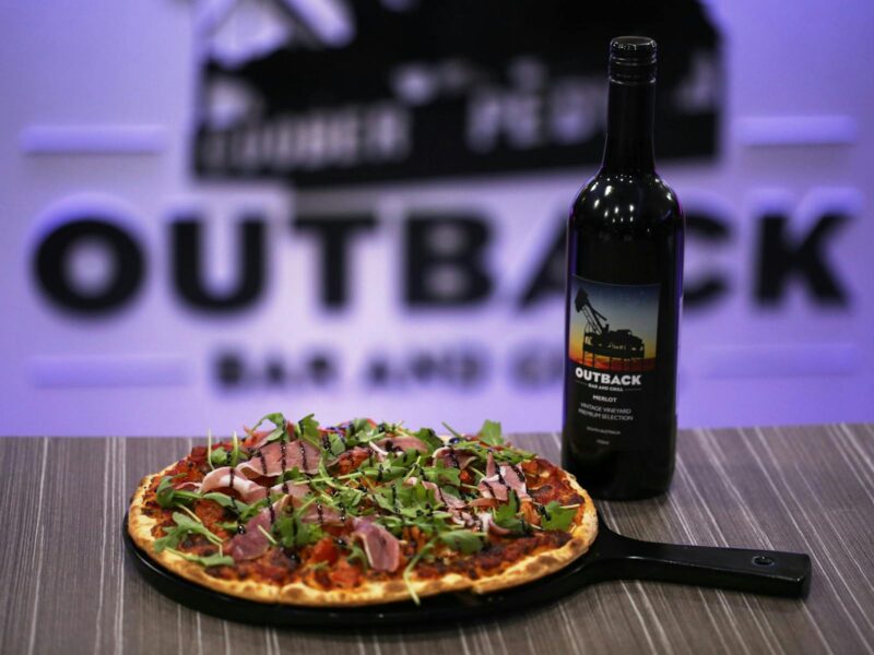ATDW Coober Pedy Outback Bar And Grill.jpeg Pizza and wine